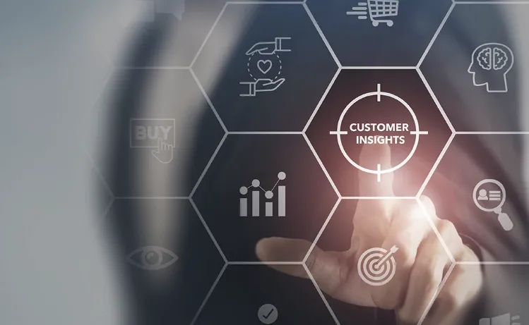 A hand pointing at a glowing "Customer Insights" icon on a futuristic digital interface, showcasing Trinergy's expertise in data-driven customer analytics solutions.