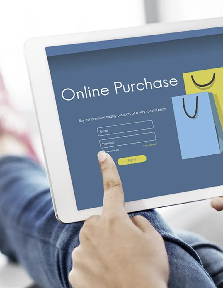 A person using a tablet with an online purchase interface, highlighting Trinergy's streamlined e-commerce solutions for secure and efficient digital shopping experiences.