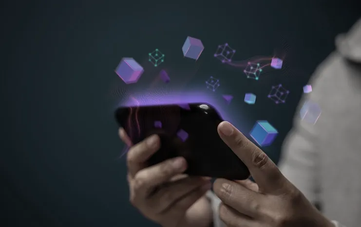 Person using a smartphone with digital cubes and network elements symbolizing digital transformation and innovation by Trinergy