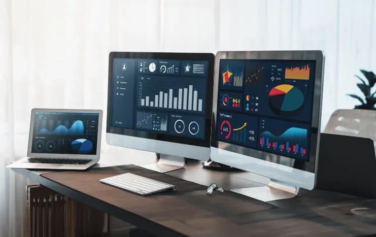 Trinergy's advanced data analytics dashboards displayed on multiple monitors for comprehensive data visualization and insights.