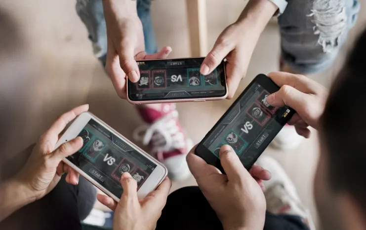 Trinergy showcases mobile multiplayer gaming, with players engaging in interactive battles on their smartphones.